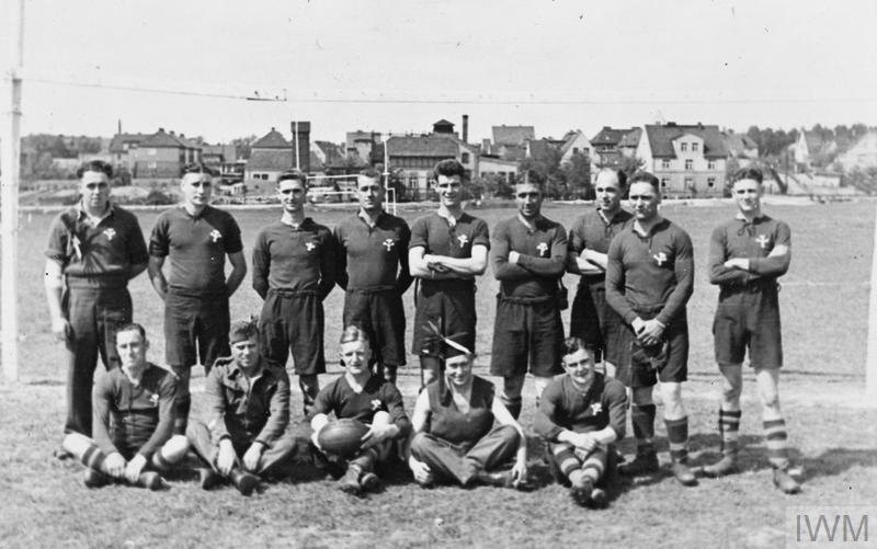 BRITISH PRISONERS OF WAR IN GERMANY, 1940-1945 (HU 9311) Members of a British POW rugby team at the town of Laband, the base for working parties E1 and E708 from the Stalag VIIIB. From left to right (probably); Lewis, Johnson, Tamblyn, Nelmes, Poole, Jones, Hill, Gardner, Jones, Maybanks, Company Sergeant Major (CSM Leader, in uniform, featured also in photographs HU 9292, HU 9293, HU 9313, HU 9314), Tovey, Murphy, Donn Copyright: © IWM. Original Source: http://www.iwm.org.uk/collections/item/object/205234560