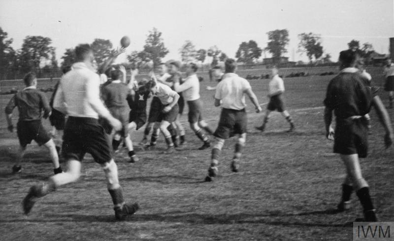 BRITISH PRISONERS OF WAR IN POLAND, 1940-1945 (HU 9303) British POWs playing rugby at the Stalag XXID, Poznan (Posen). Copyright: © IWM. Original Source: http://www.iwm.org.uk/collections/item/object/205234553